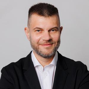 Юрий Юшкевич — докладчик AI Cases Conf 2026